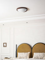 Round wooden ceiling light angle view on white