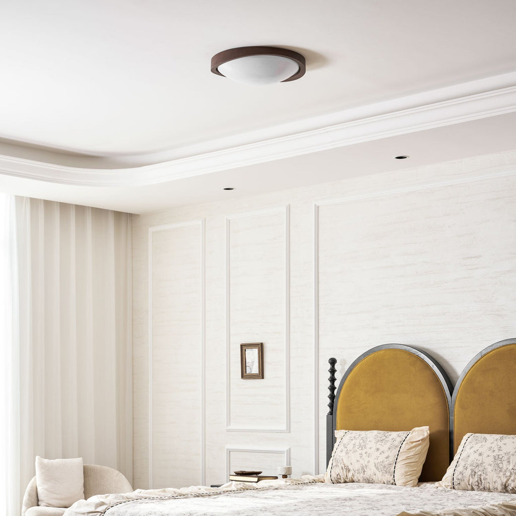 Walnut flush mount ceiling light detail on a white background