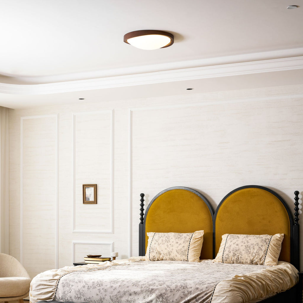 Wooden curved edge ceiling light shown from the side on white