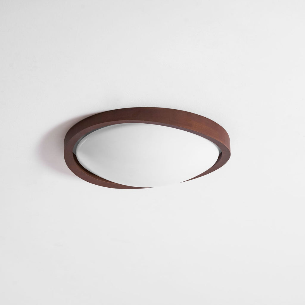 Walnut curved edge ceiling light glowing in a cozy interior