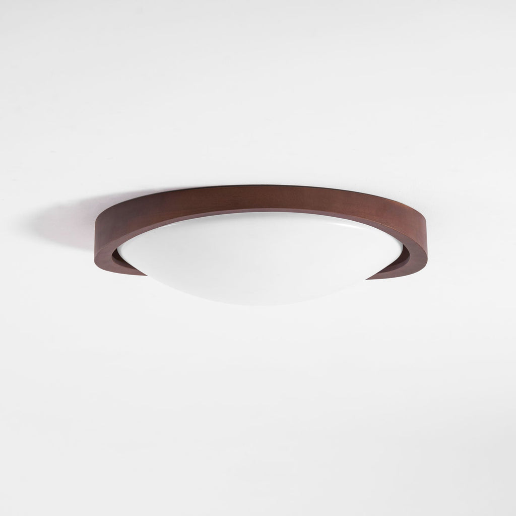 Wooden ceiling light casting a soft glow in a warm room