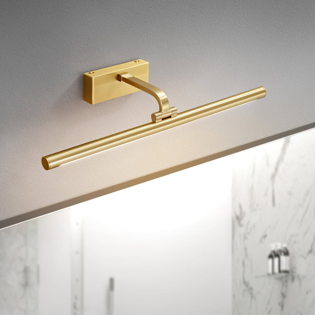 Mounted above white marble tiling, this Clérachic wall light in brass glows at a side angle.