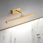 Mounted above white marble tiling, this Clérachic wall light in brass glows at a side angle.