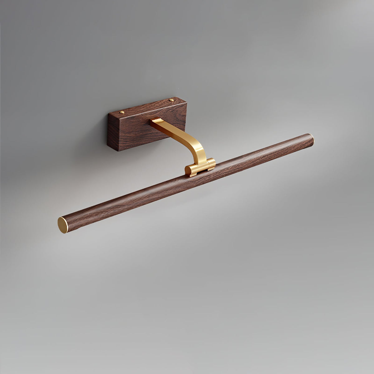 Close view of the walnut and brass pivot joint on this Clérachic wall light, unlit.