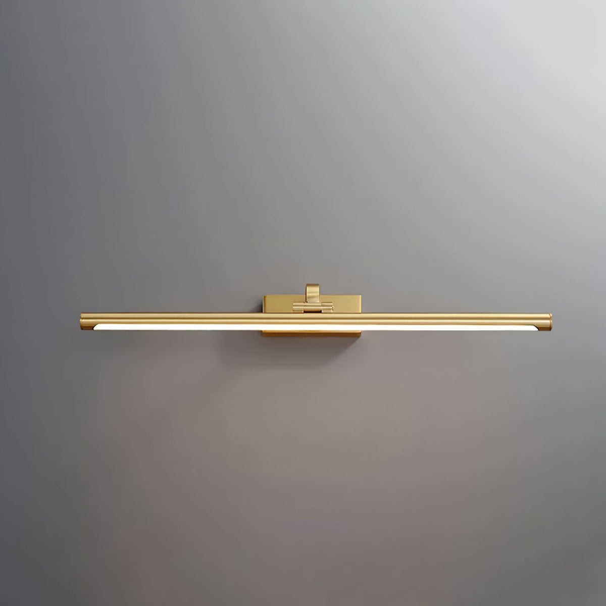 Front view of this Clérachic wall light in brass, lit, centred on a plain grey backdrop.