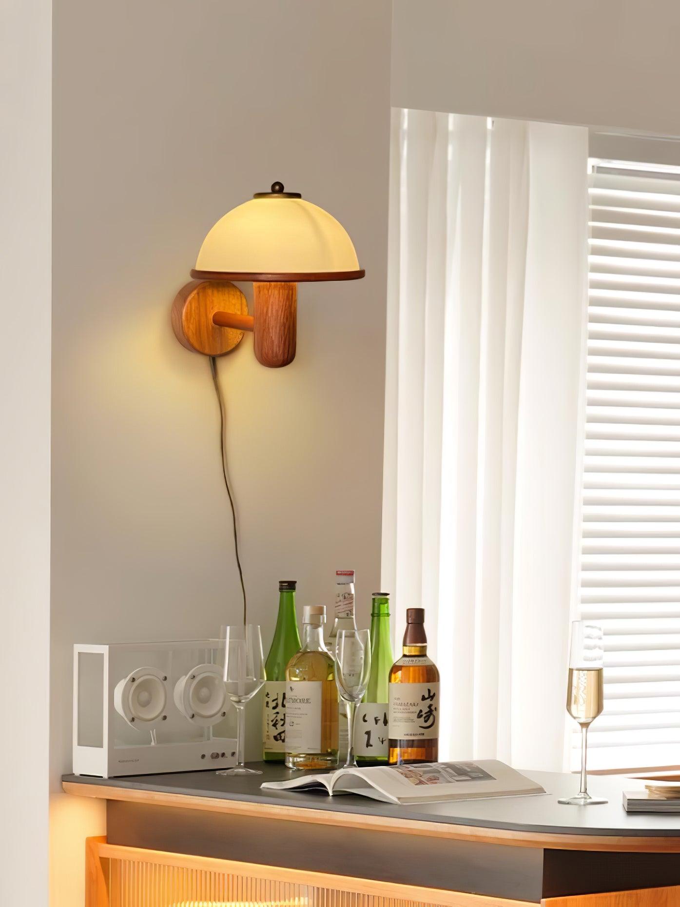 Mushroom wall lamp with white shade glowing in a quiet living space