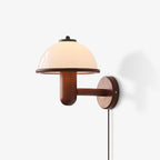 Dark oak mushroom wall lamp styled as a warm accent in a room