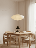White swag pendant light draped over a plug-in cord