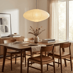 Round washi paper pendant light with diffused amber glow