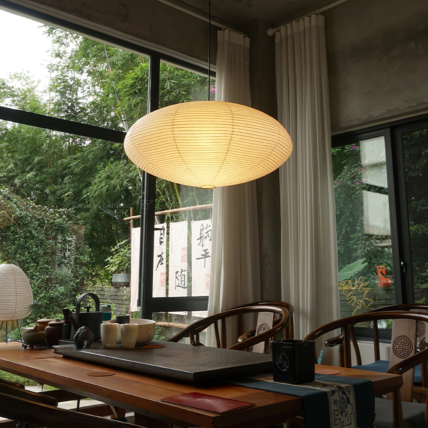 Washi paper pendant light glowing softly in an interior