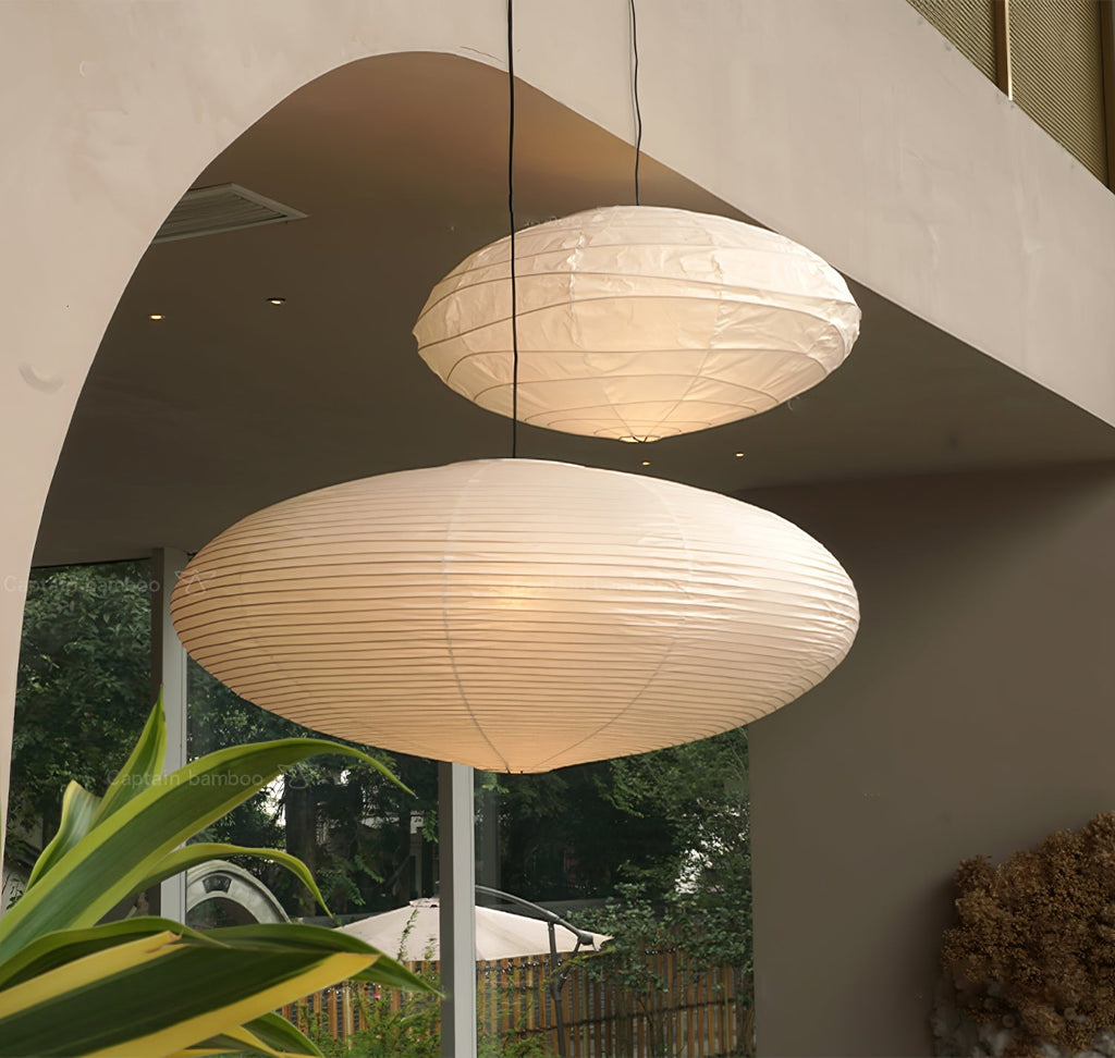 Washi paper pendant light glowing above a living space