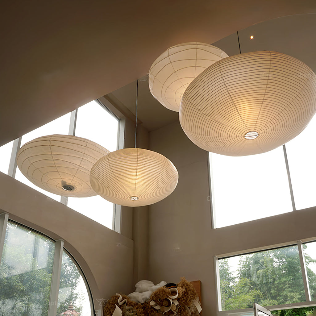 Large washi paper pendant light over a styled dining area