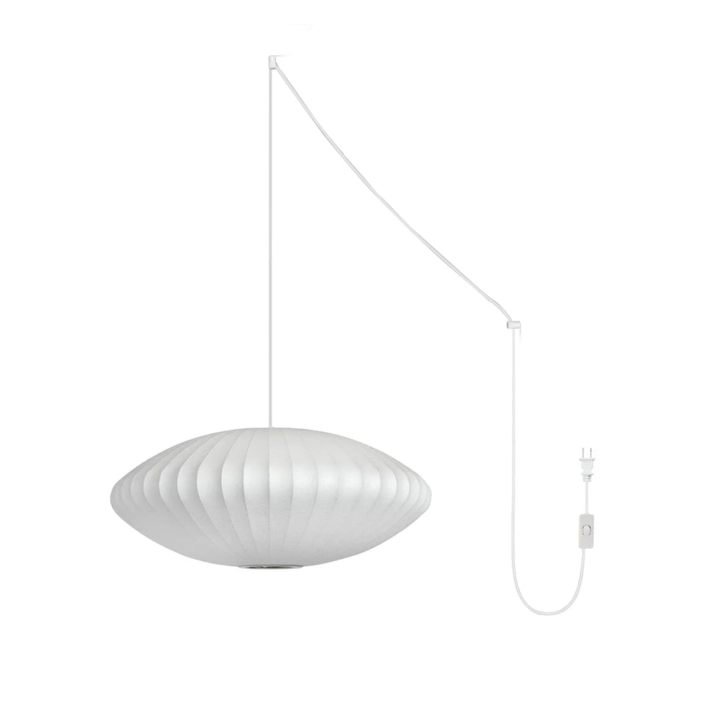 Nelson Bubble Swag Pendant Light with white steel wireframe glowing in a styled room