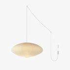 Mulberry paper swag pendant casting a warm diffused glow