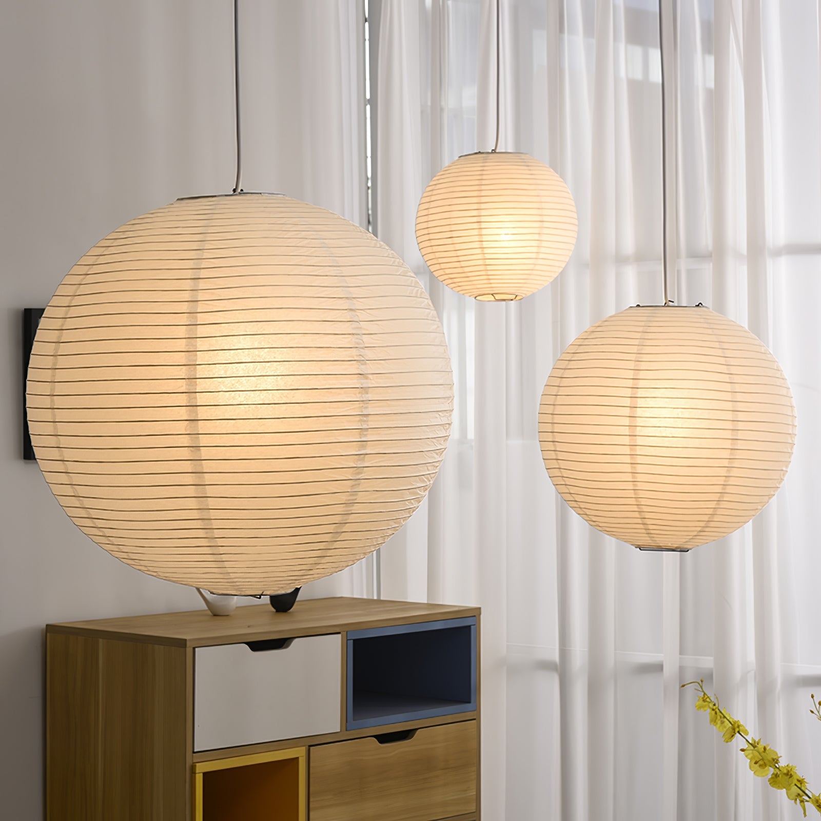 Mulberry paper pendant glowing in a calm interior