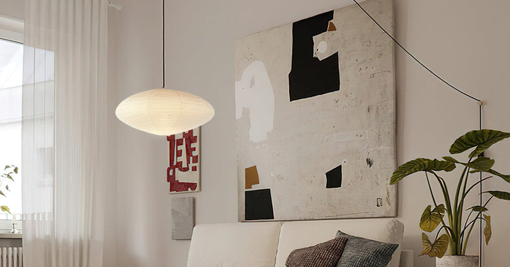 Handmade paper pendant light casting a warm glow