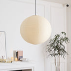 Round washi paper pendant lit softly from within