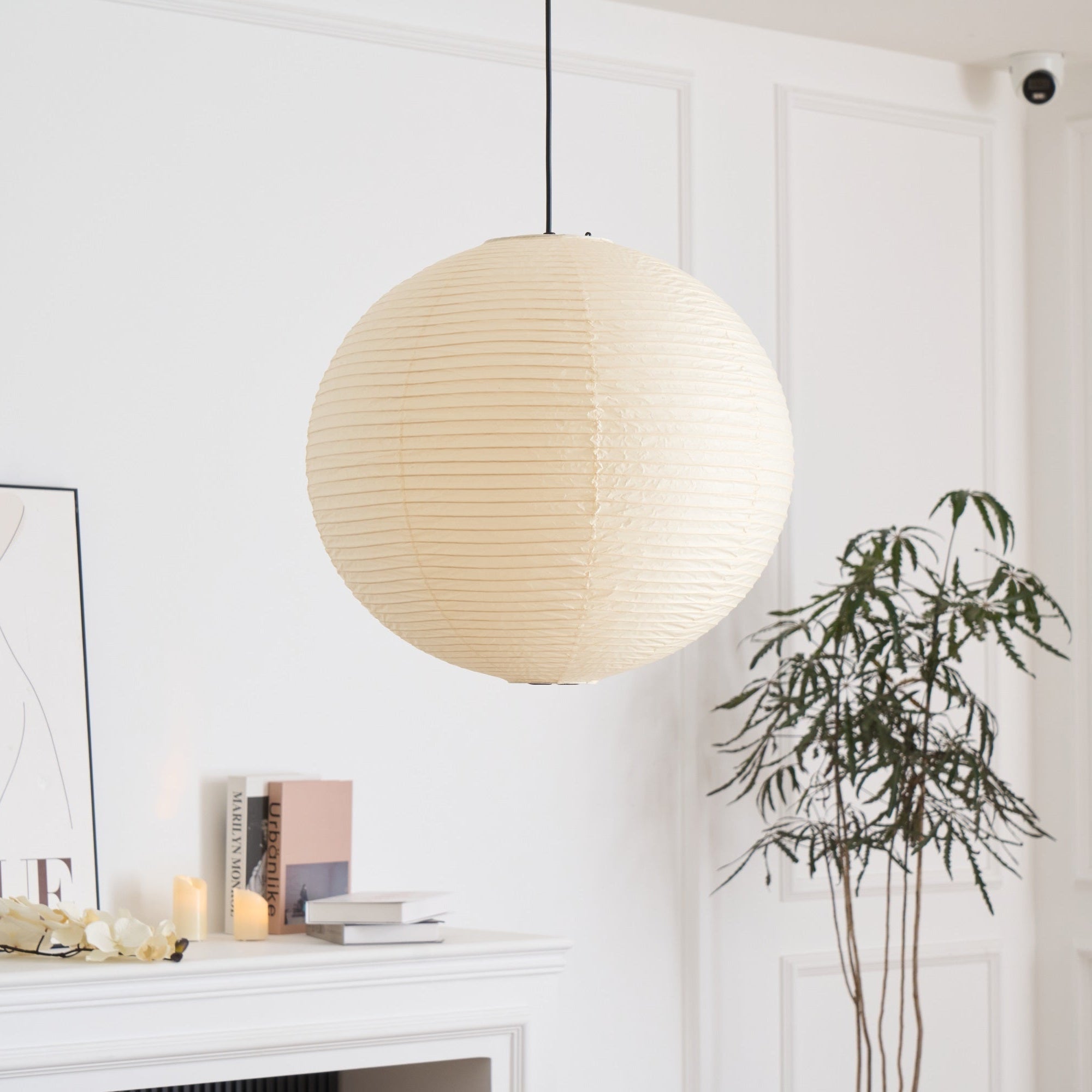 Round washi paper pendant lit softly from within