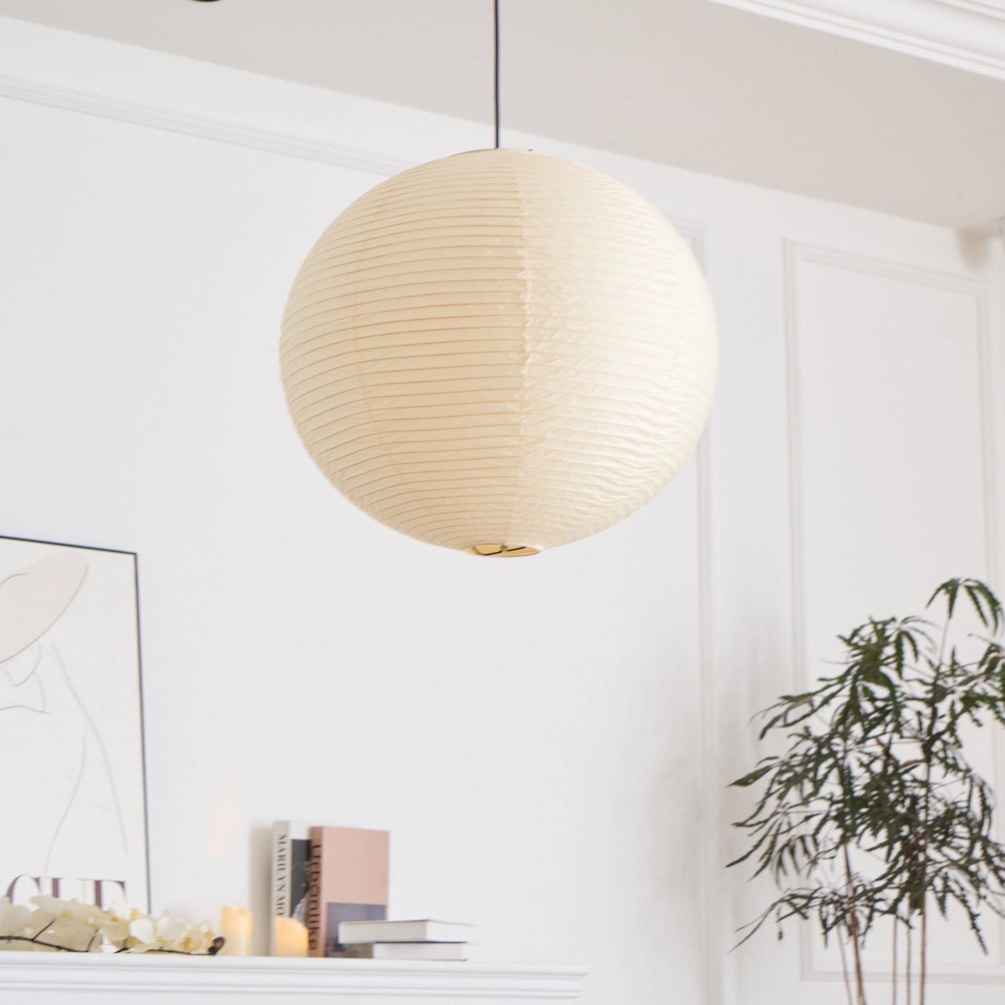 Mulberry paper pendant lit warm in a bedroom