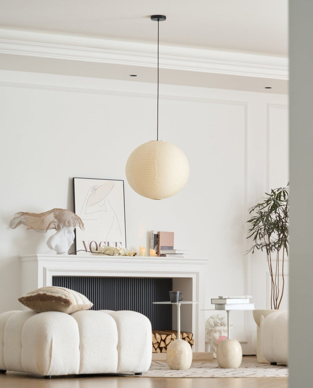 Round washi paper pendant glowing over a room