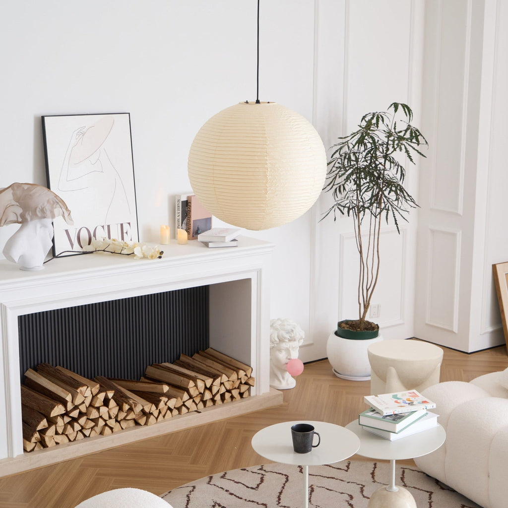 White washi paper pendant glowing above a sofa