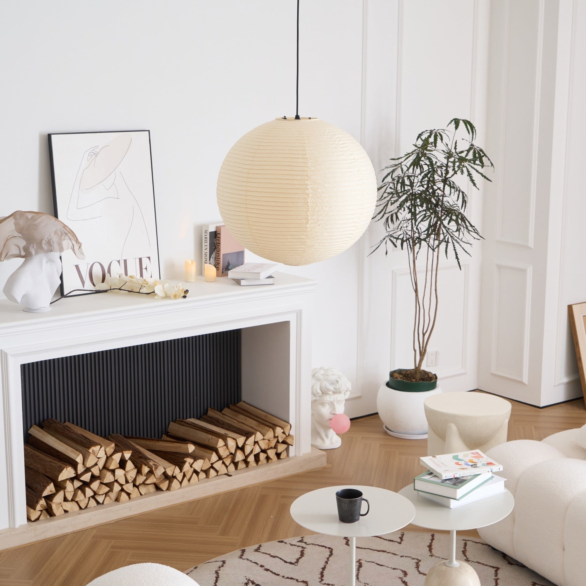White washi paper pendant glowing above a sofa