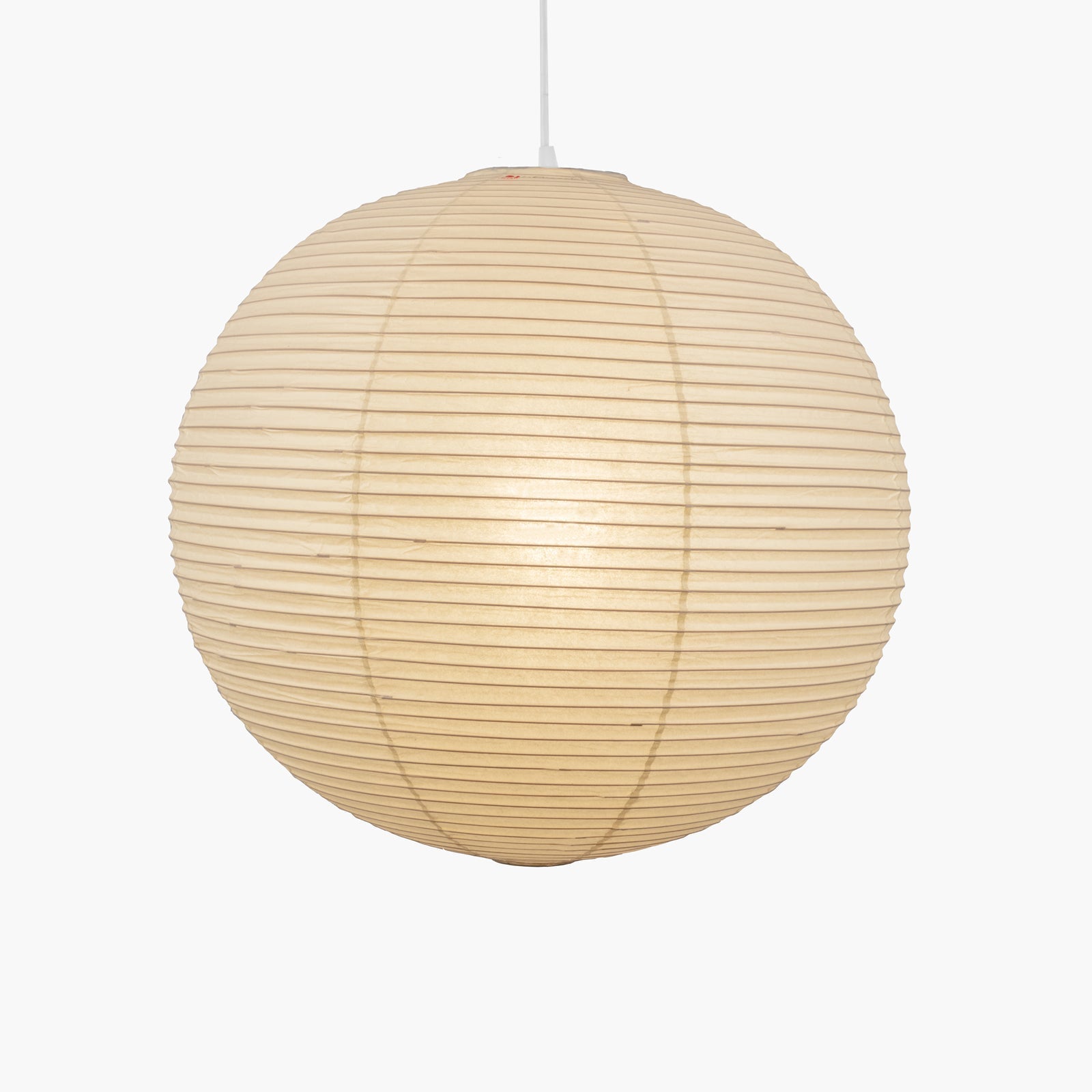 Round paper pendant light styled in an interior