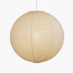 Paper ceiling pendant lit warm over seating
