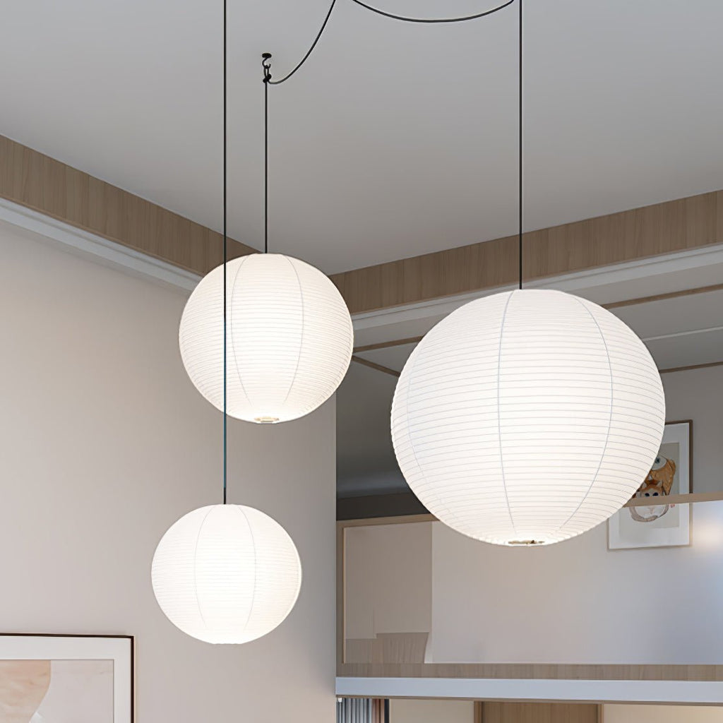 White paper sphere pendant light with warm sourceless glow