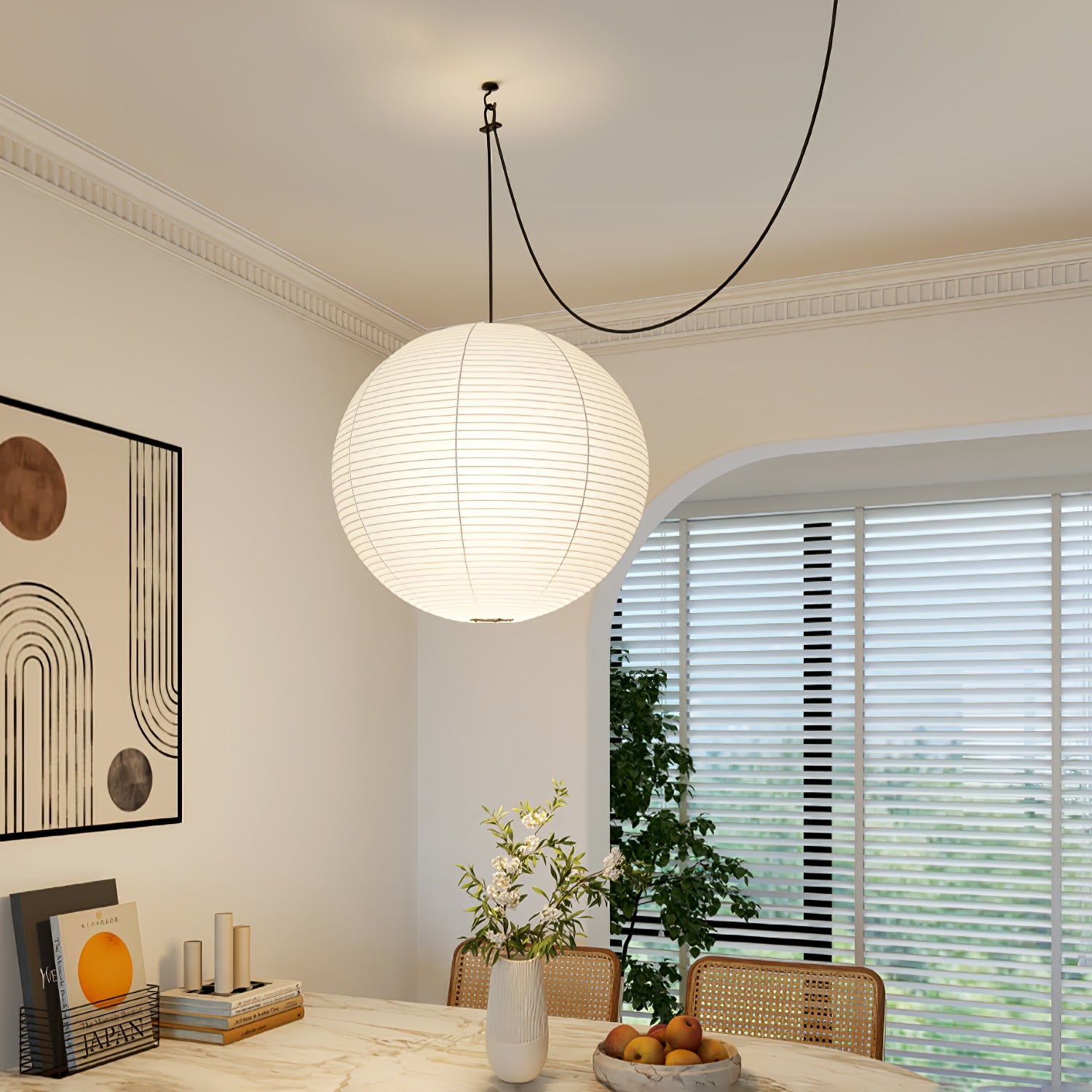 Mulberry paper globe pendant light glowing in an interior