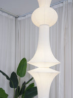 White washi paper pendant glowing in a calm room