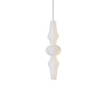 Tall white washi paper pendant glowing in a high-ceiling room