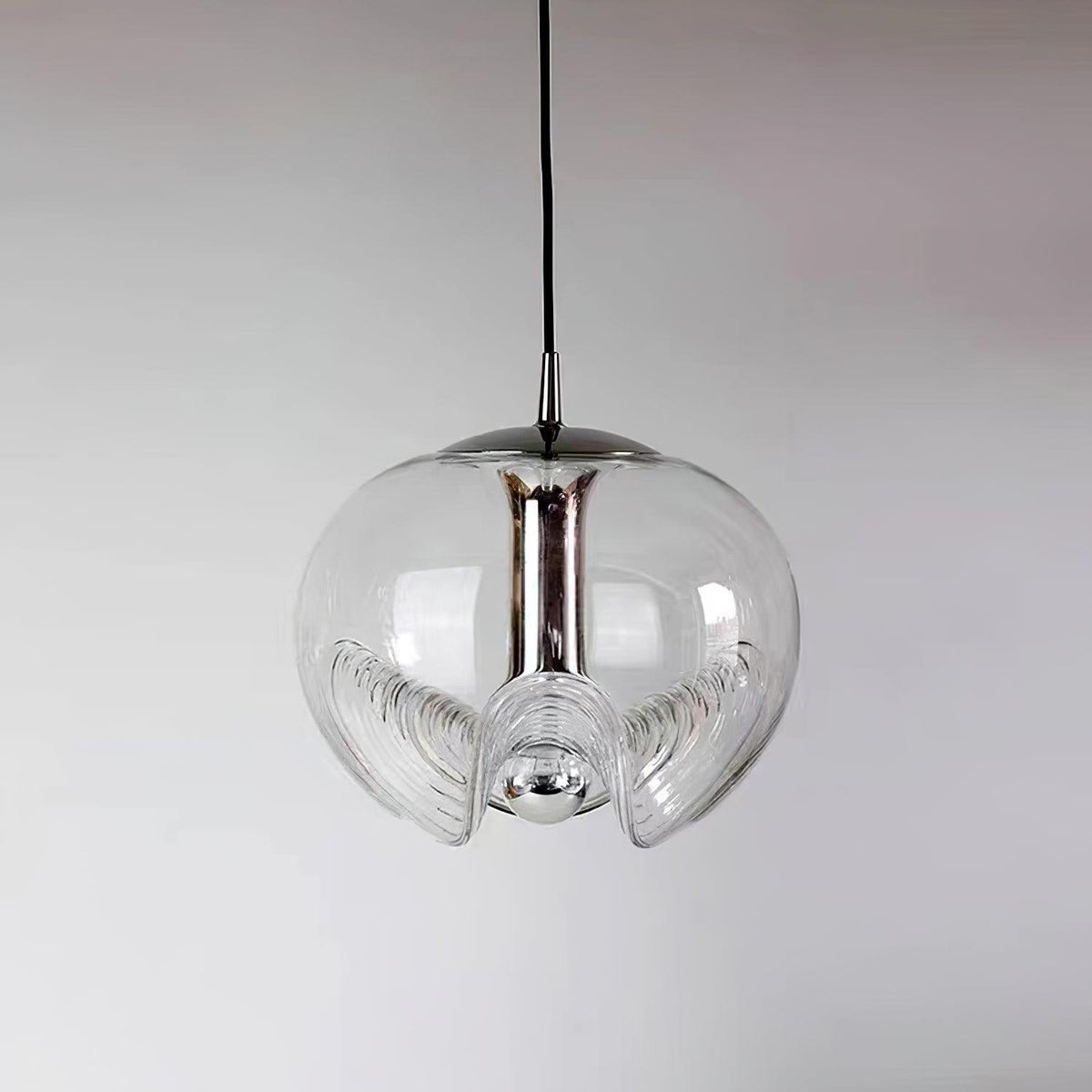 Product shot of this Clérachic pendant's clear glass shade and silver frame, unlit against a soft grey gradient background.