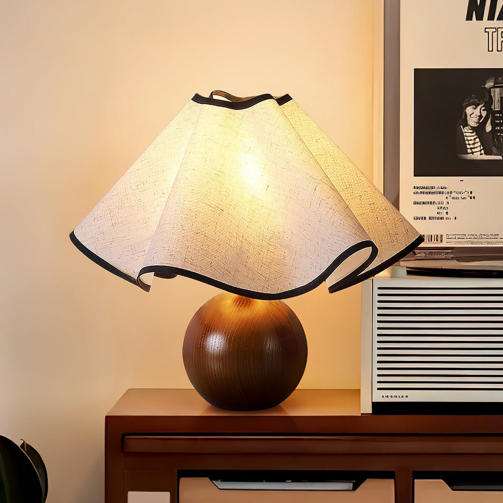 Wavecrest table lamp lit on a console with warm ambient glow