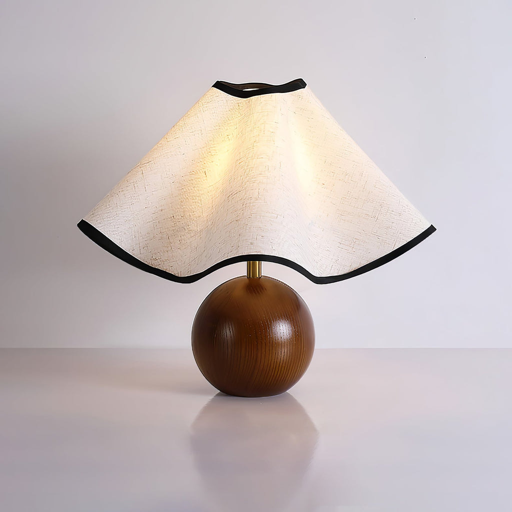 Wavecrest table lamp on a table beside soft furnishings