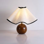 Wavecrest table lamp on a table beside soft furnishings