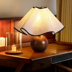 Wavecrest table lamp on a wood base set in a coastal-styled interior