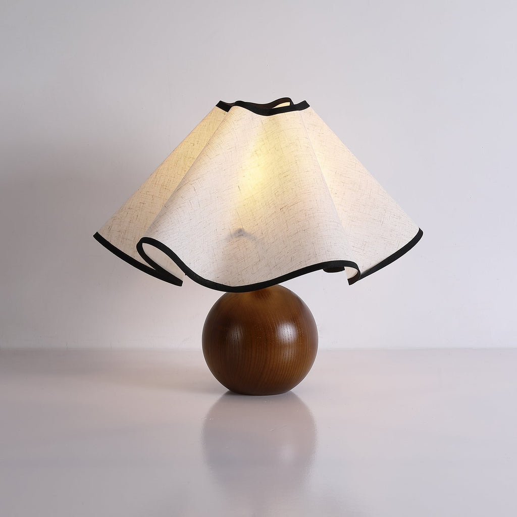 Wavecrest table lamp with black base and linen shade