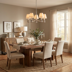 This brushed nickel Clérachic chandelier lights a dining table dressed with candlesticks and framed botanical prints.