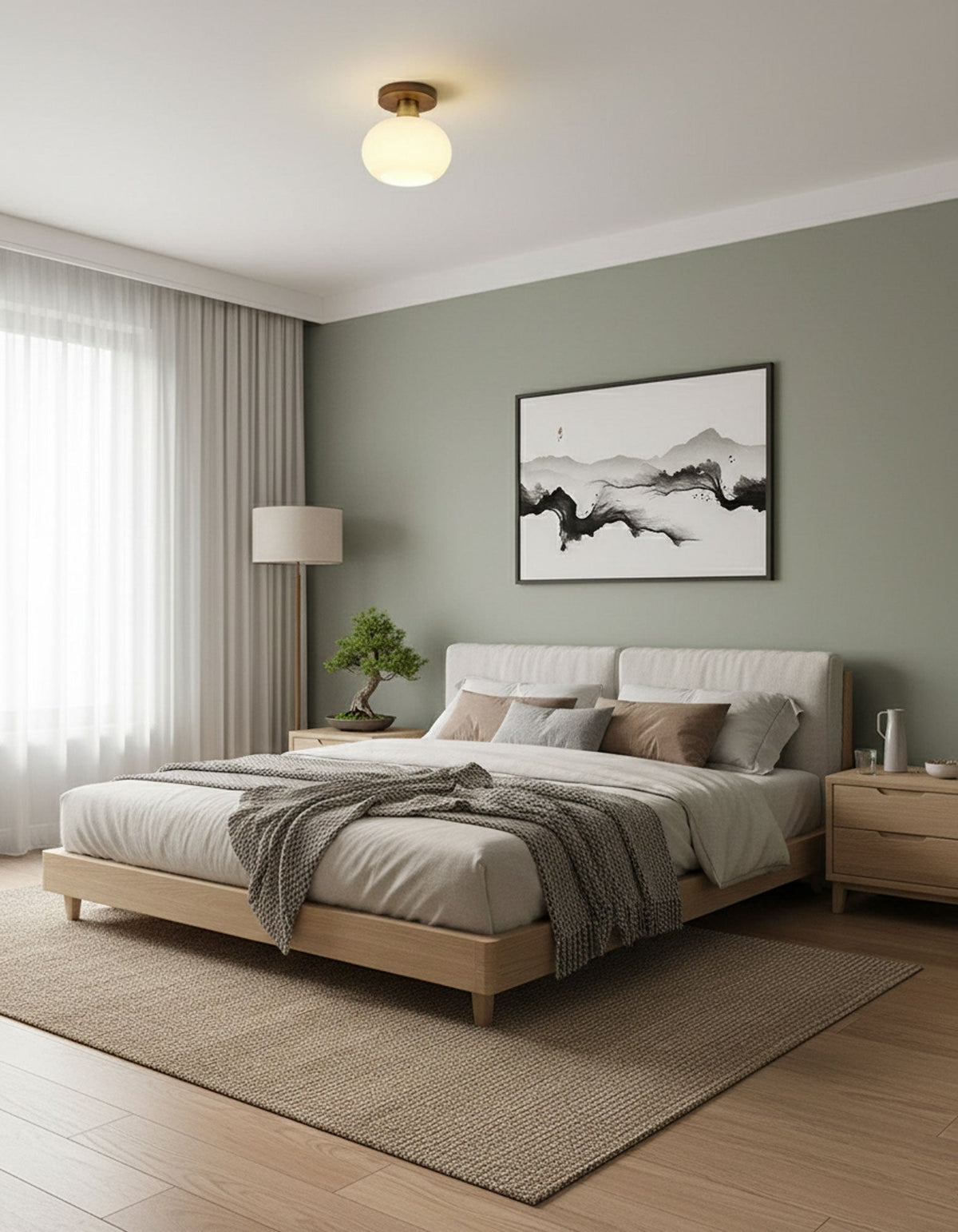 Warm light spills from this Clérachic ceiling light above a bed with white linens in a sage-green room.