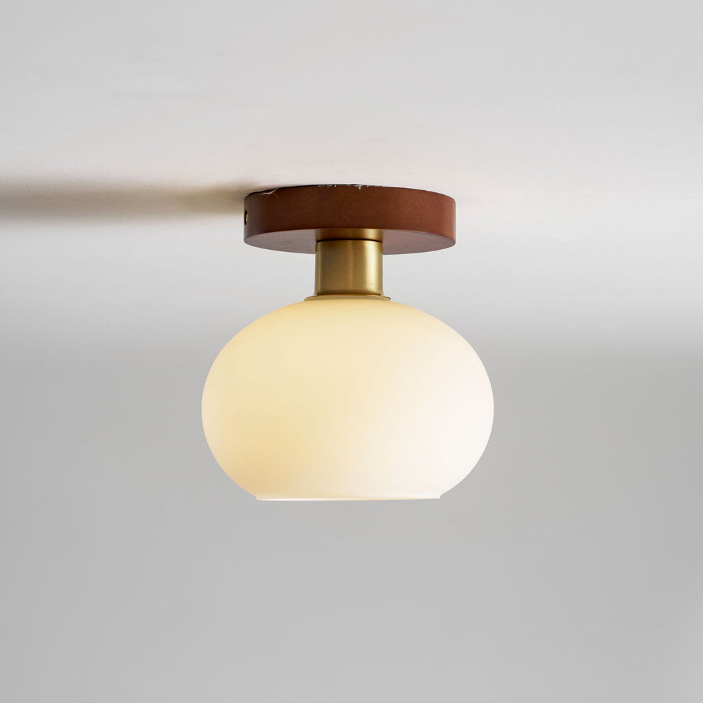 Facing forward on a plain grey background, this Clérachic ceiling light sits unlit.