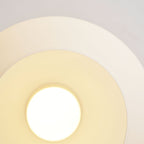 Close view of the lit opal glass globe on this Clérachic ceiling light, its warm glow spreading across the ceiling.