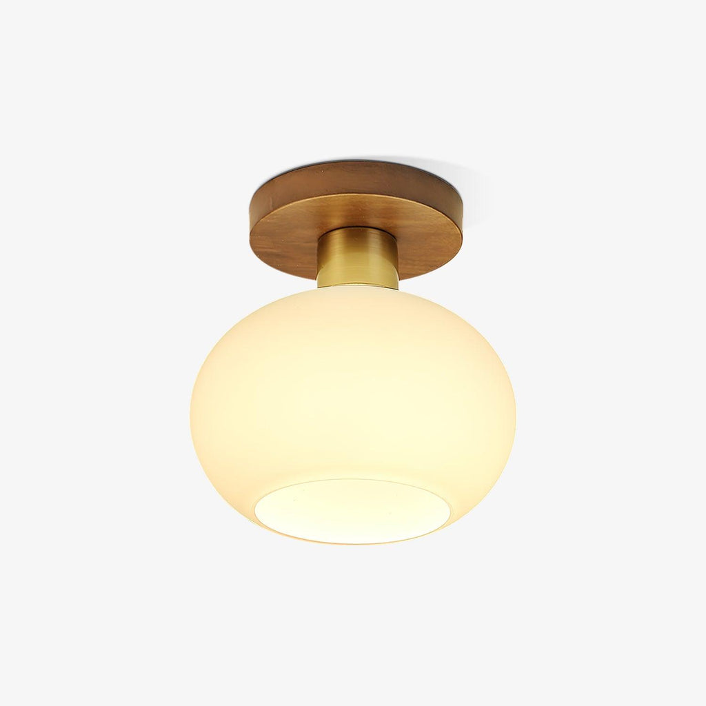 Set against a plain background, this Clérachic ceiling light shows its walnut canopy and copper neck unlit.