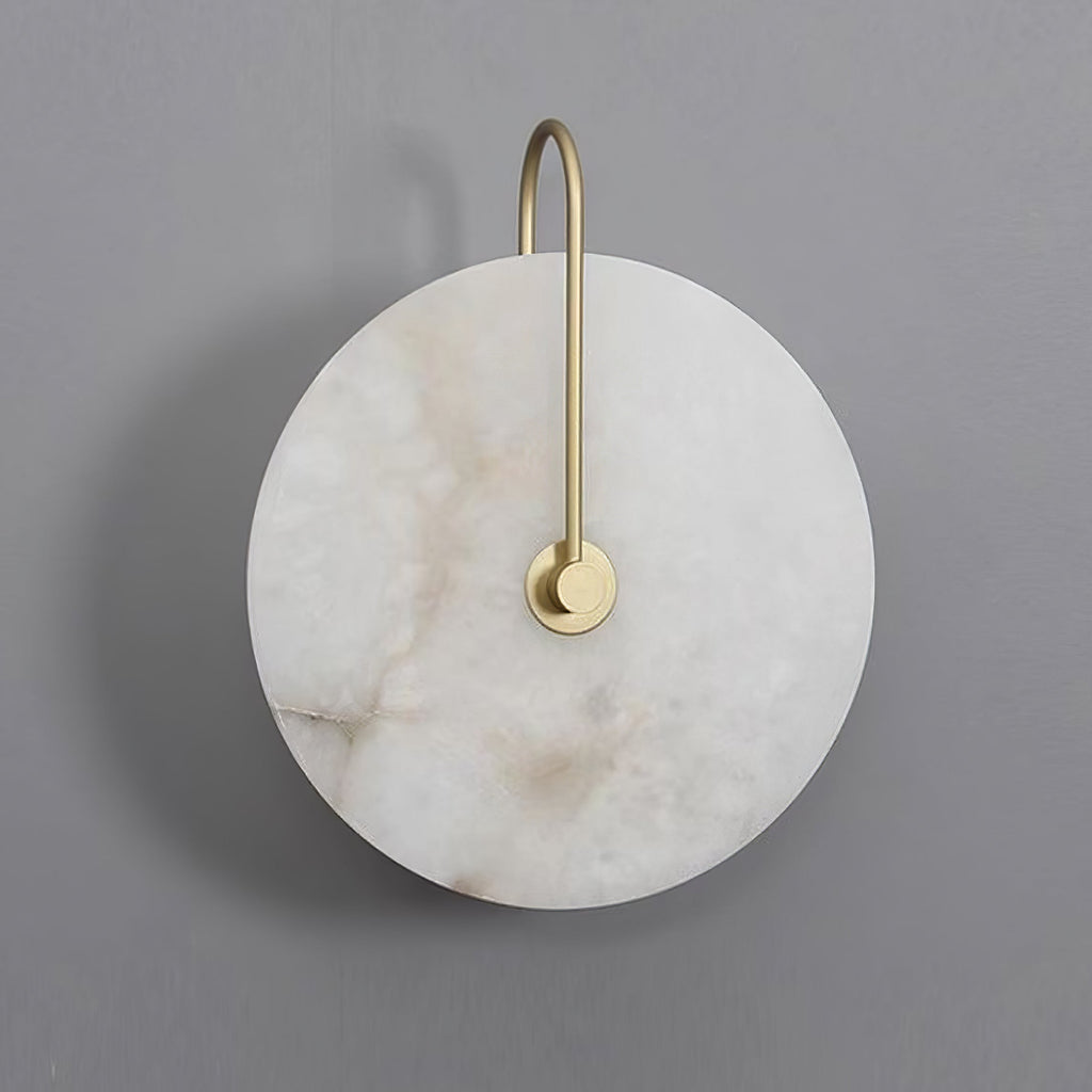 Unlit Elaris wall light in gold on grey, the stone disc marked with warm brown veining.