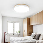Wooden ceiling light glowing softly in a dim room