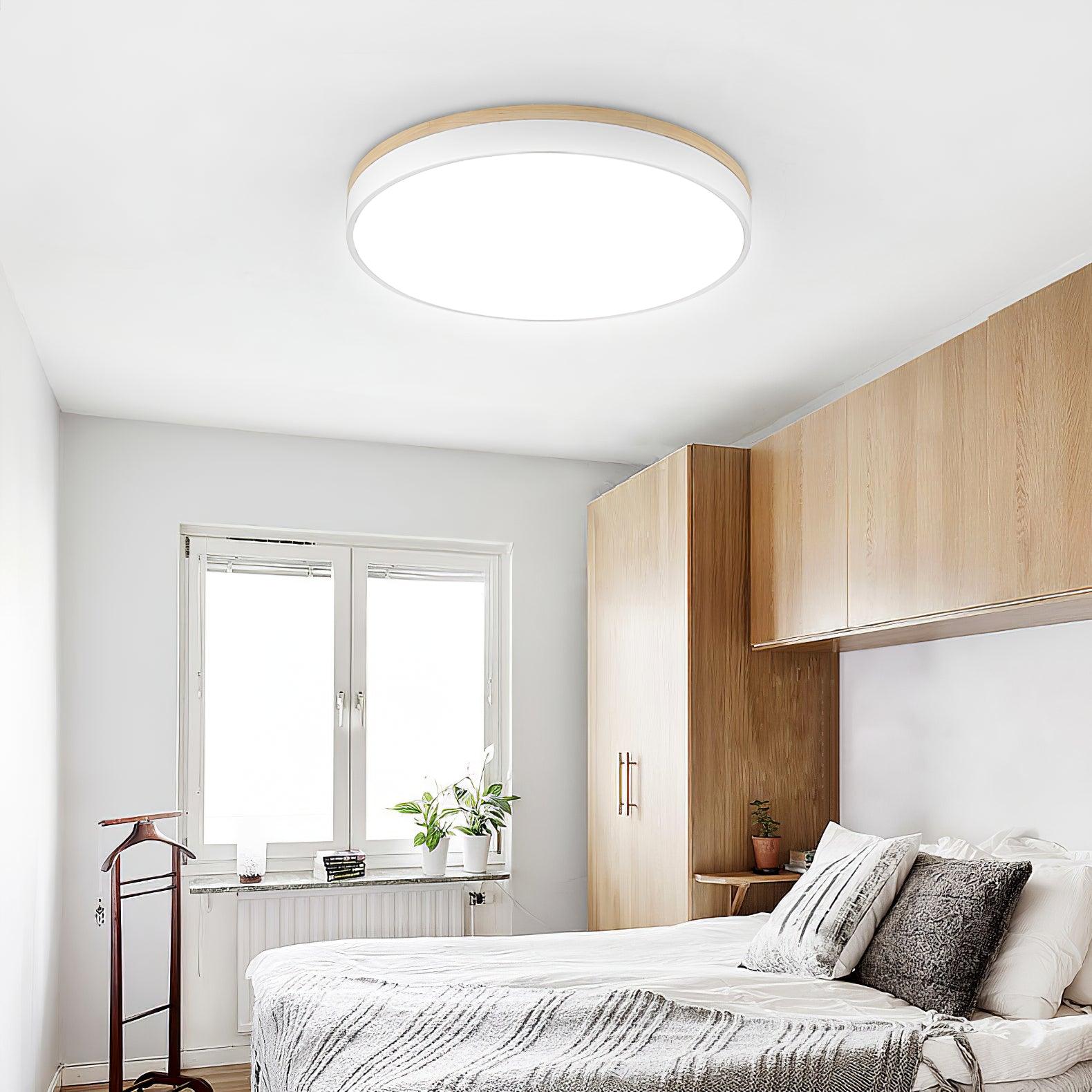Wooden ceiling light glowing softly in a dim room