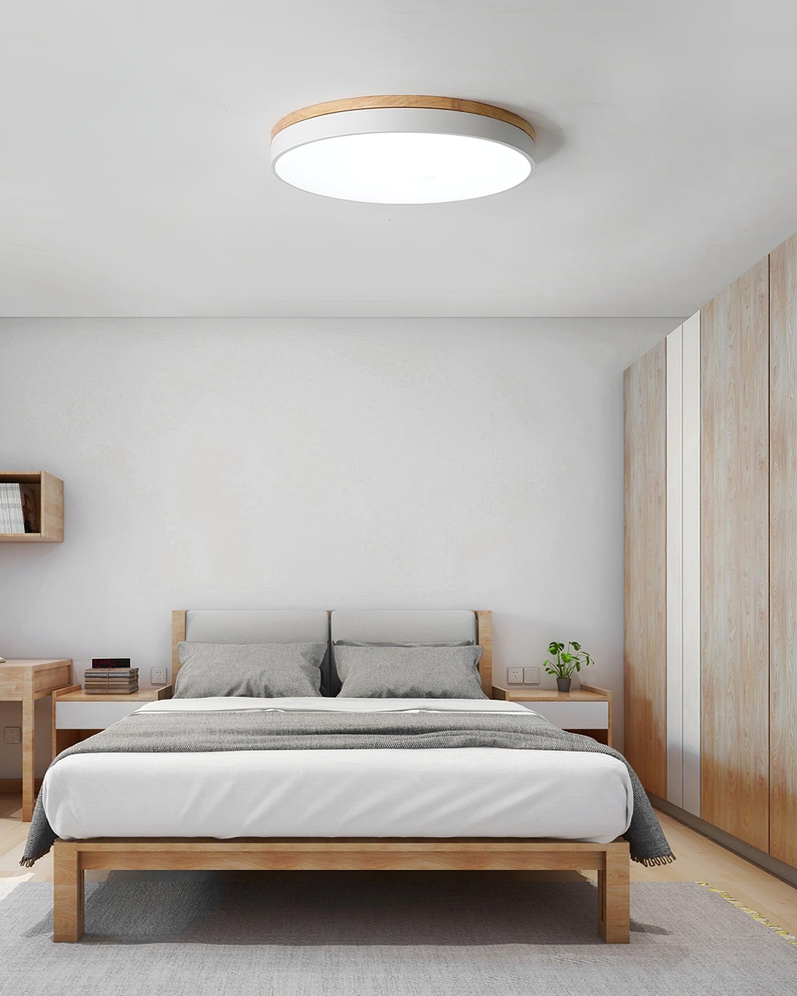 Round wood and white ceiling light in a calm interior