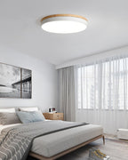 White ceiling light with wood edge mounted on a ceiling