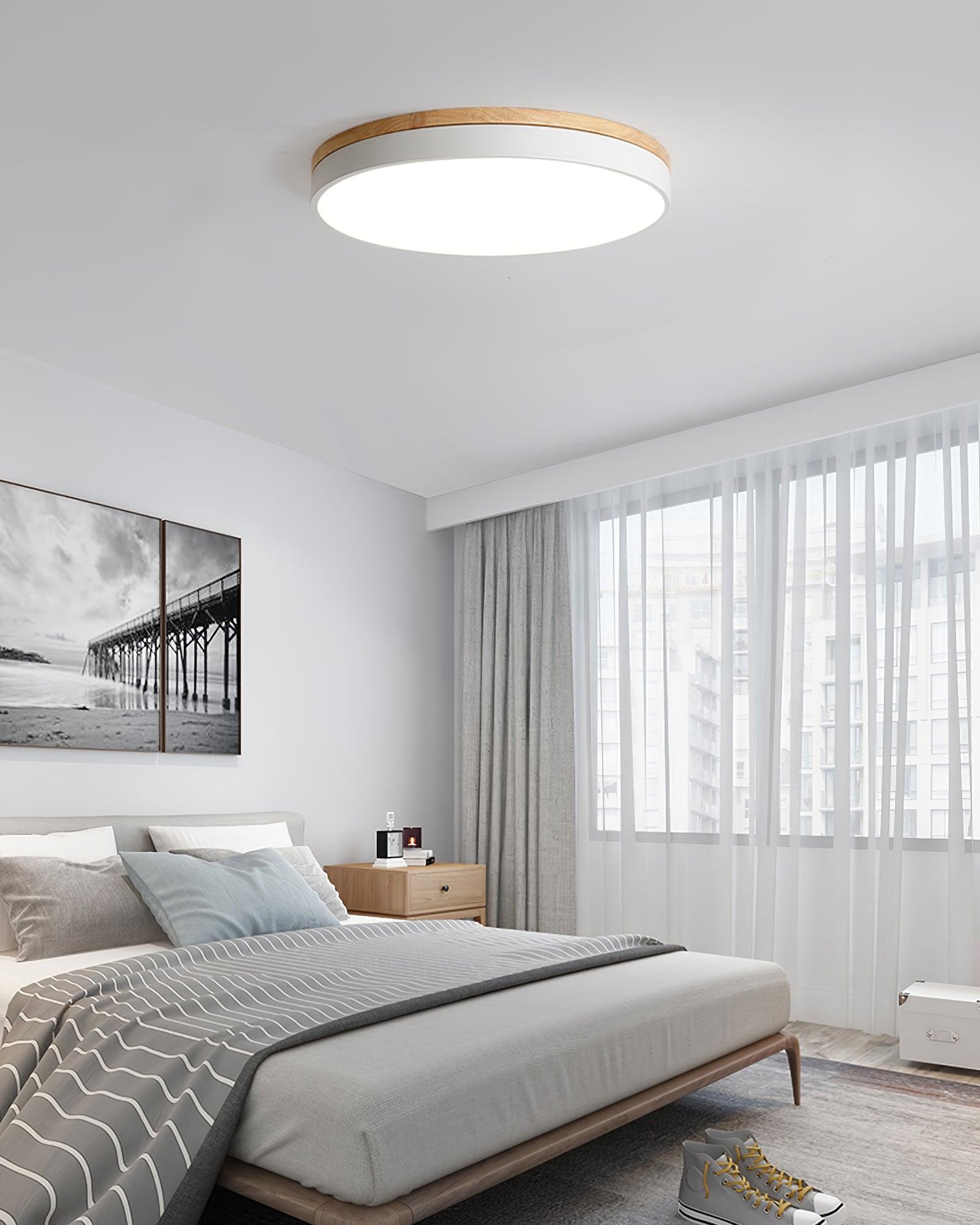 White ceiling light with wood edge mounted on a ceiling