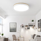White ceiling light with wood edge in a neutral room